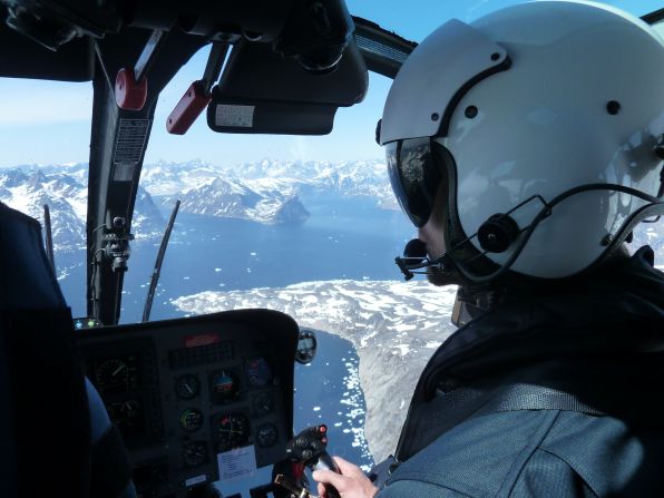Pilot Karsten Andsbjerg flying the helicopter. Flying here is extremely difficult because of gusty winds and rapidly changing weather.