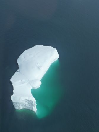 SIngle iceberg under the survey helicopter.