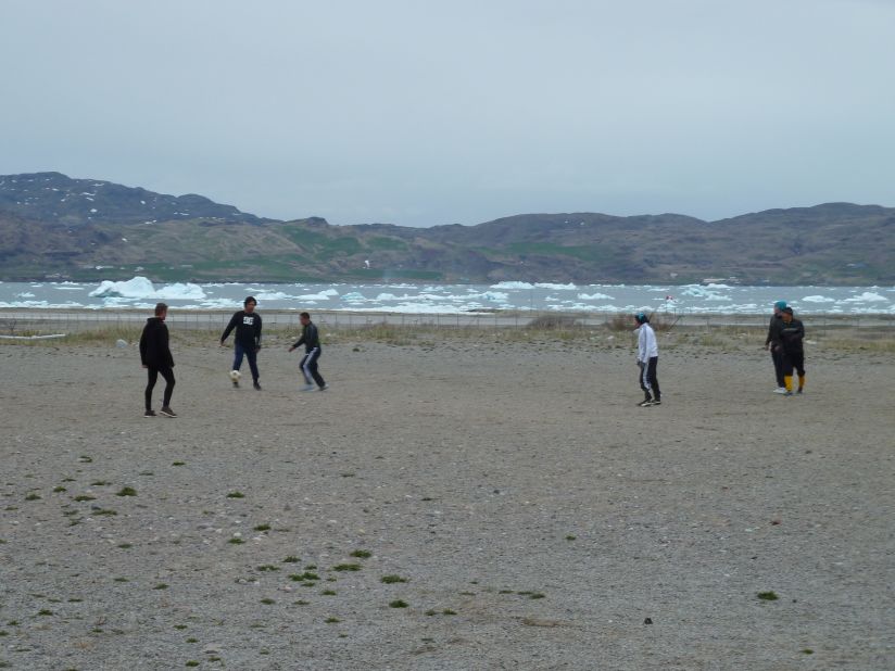 Greenlanders play soccer in front of a field of icebergs. It seems this place was much more hospitable 1,000 years ago.