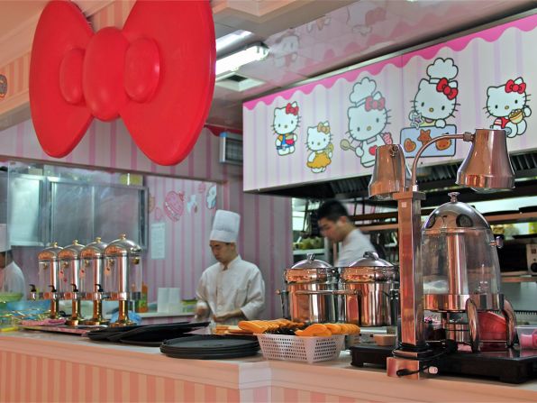 A large open kitchen dominates one side of the restaurant. 