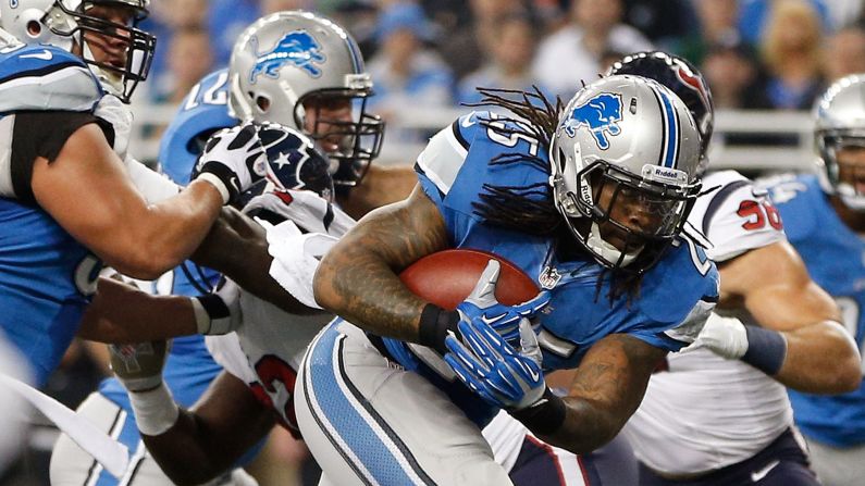 Mikel Leshoure of the Detroit Lions runs for a touchdown in the first quarter against the Houston Texans on Thursday at Ford Field in Detroit. The Texans won 34-31 in overtime.