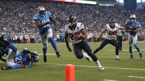 Arian Foster of the Houston Texans runs six yards for a touchdown in the second quarter against the Detroit Lions on Thursday.