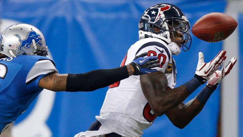 Andre Johnson of the Houston Texans makes a catch in front of Louis Delmas of the Detroit Lions on Thursday.