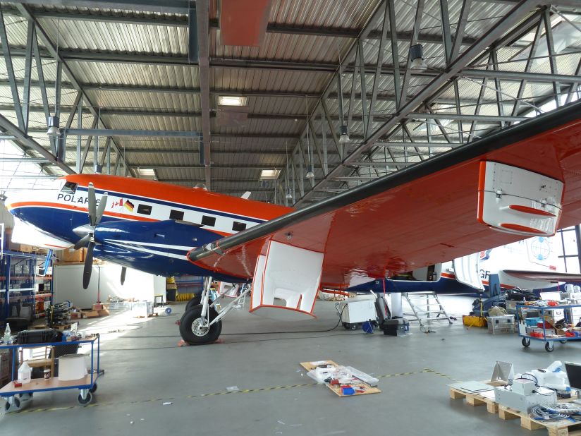 Research Aircraft POLAR 6 being outfitted with scientific antennas and computers at the Alfred-Wegener-Institutes hangar in Bremerhaven, Germany. The plane is a totally rebuilt DC-3 Dakota from World War II. 