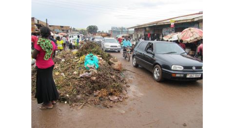 Uncollected waste lies in the streets of an urban slum in Uganda, which can cause flooding and breeding sites for waterborne diseases. 