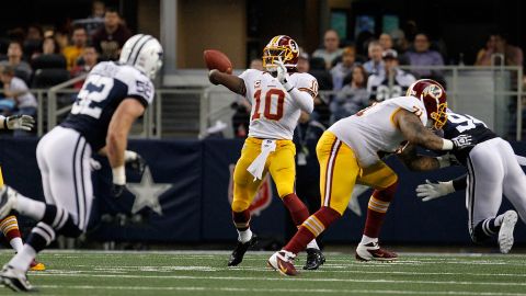 Quarterback Robert Griffin III of the Washington Redskins looks for an open receiver during Thursday's game against the Dallas Cowboys.
