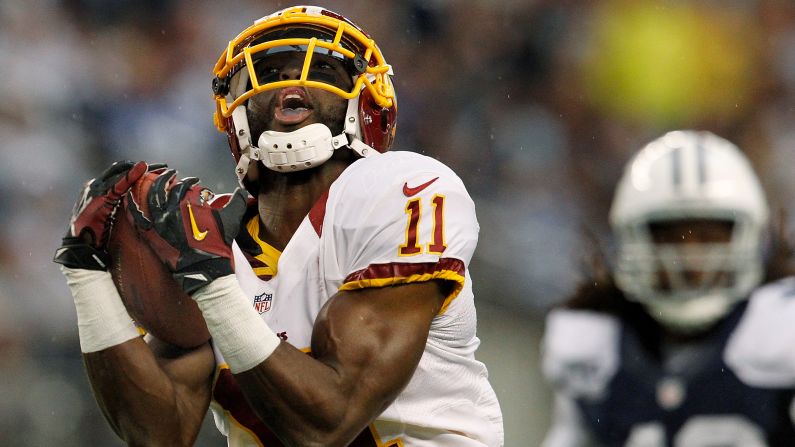 Aldrick Robinson of the Washington Redskins pulls in a pass for a touchdown during the Thanksgiving Day game against the Cowboys.