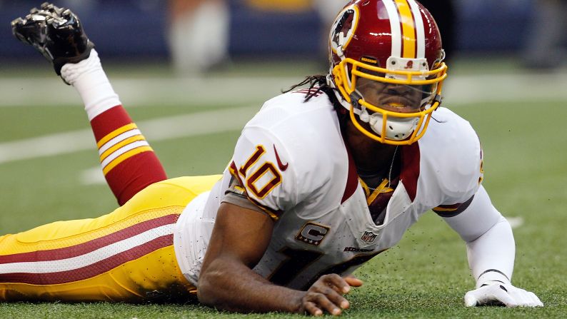 Robert Griffin III of the Washington Redskins reacts after being sacked Thursday by Jason Hatcher of the Dallas Cowboys.