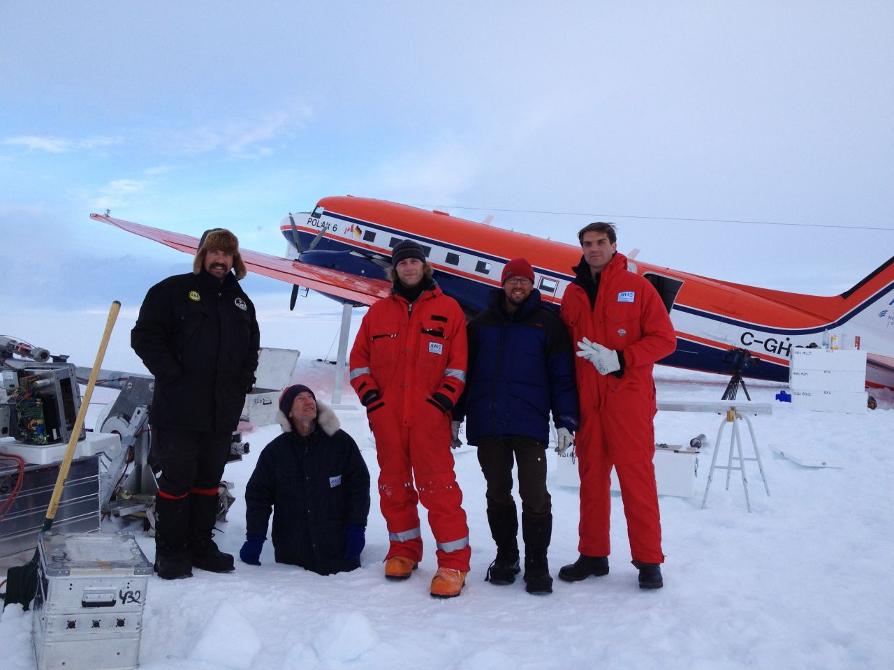 Ice core drilling crew with CNN correspondent Fred Pleitgen. Glaciologist Sepp Kipfstuhl standing in a hole for fun!