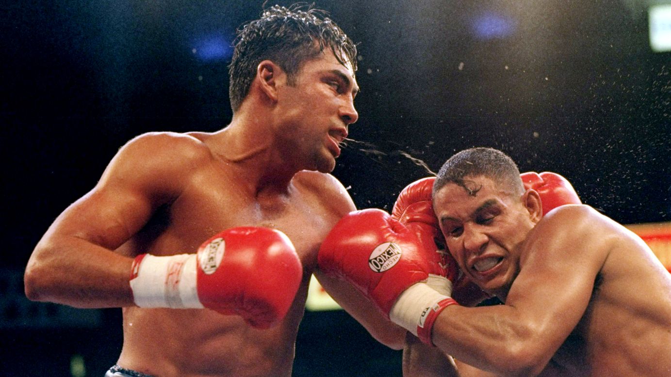 Oscar De La Hoya battles Camacho during a match in Las Vegas on September 13, 1997.
