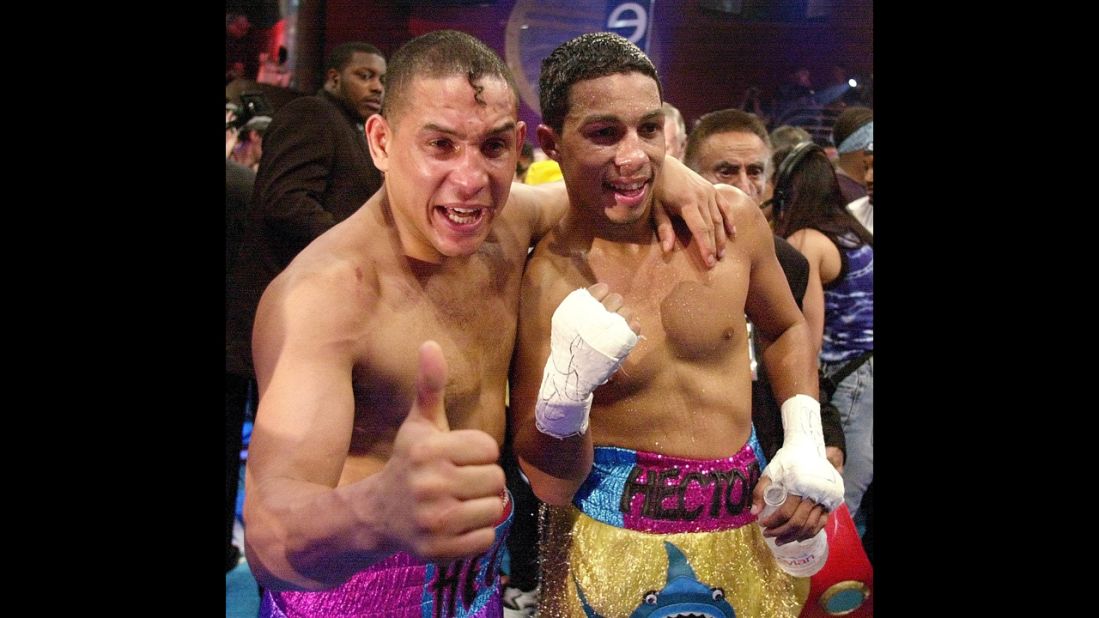 Camacho and his son, undefeated super lightweight champion Hector "Macho" Camacho Jr., celebrate their wins in Miami on February 3, 2001. They were the first father and son tandem to share the same boxing card since 1975.