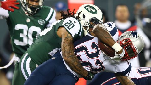 Stevan Ridley of the New England Patriots is tackled by Kyle Wilson of the New York Jets.