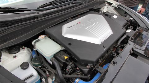 The fuel-cell stack converts hydrogen into electricity to charge the battery, which in turn drives the motor.