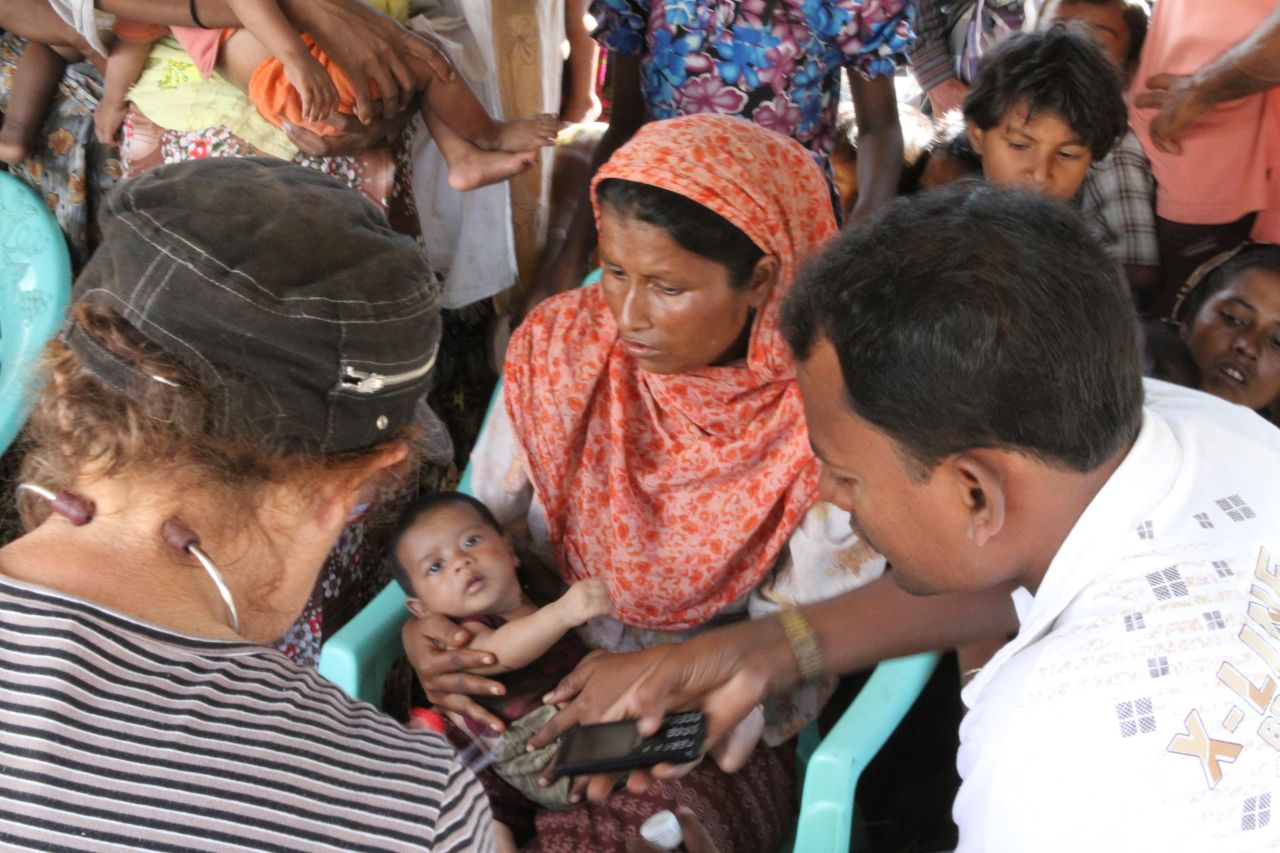 Two foreign doctors visit this camp not far from Sittwe. They are here unofficially and do not want their faces shown. NGOs are having great difficulty getting permission to come in and help.