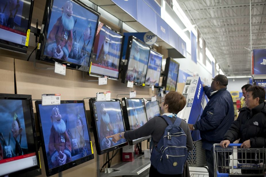 Shoppers pick out televisions at Walmart during Black Friday sales in Quincy, Massachusetts.