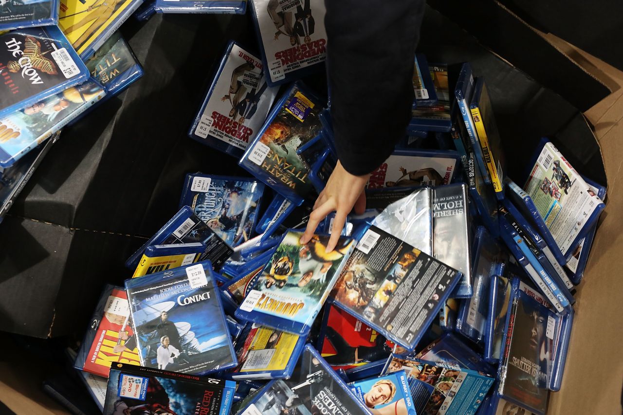 A shopper looks through movies and games at a Best Buy store in Naples, Florida.
