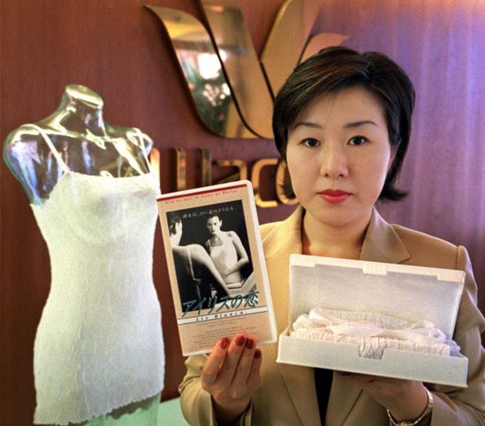 Chiaki Kobayashi, an employee of Japan's leading underwear maker Wacoal, displays 'cinema lingerie' packed in a video cassette tape case-- a gift to mark White Day, one of Japan's romantic holidays.