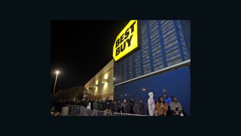 Shoppers queue outside of a Best Buy store during its Black Friday sale, which started at midnight on Friday in Rockville, Maryland.