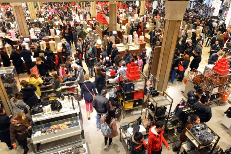 People crowd Macy's department store in New York at the start of Black Friday shopping weekend.  Thanksgiving is now victim to the Christmas shopping season, with stores welcoming shopaholics before the turkey can be taken from the oven.