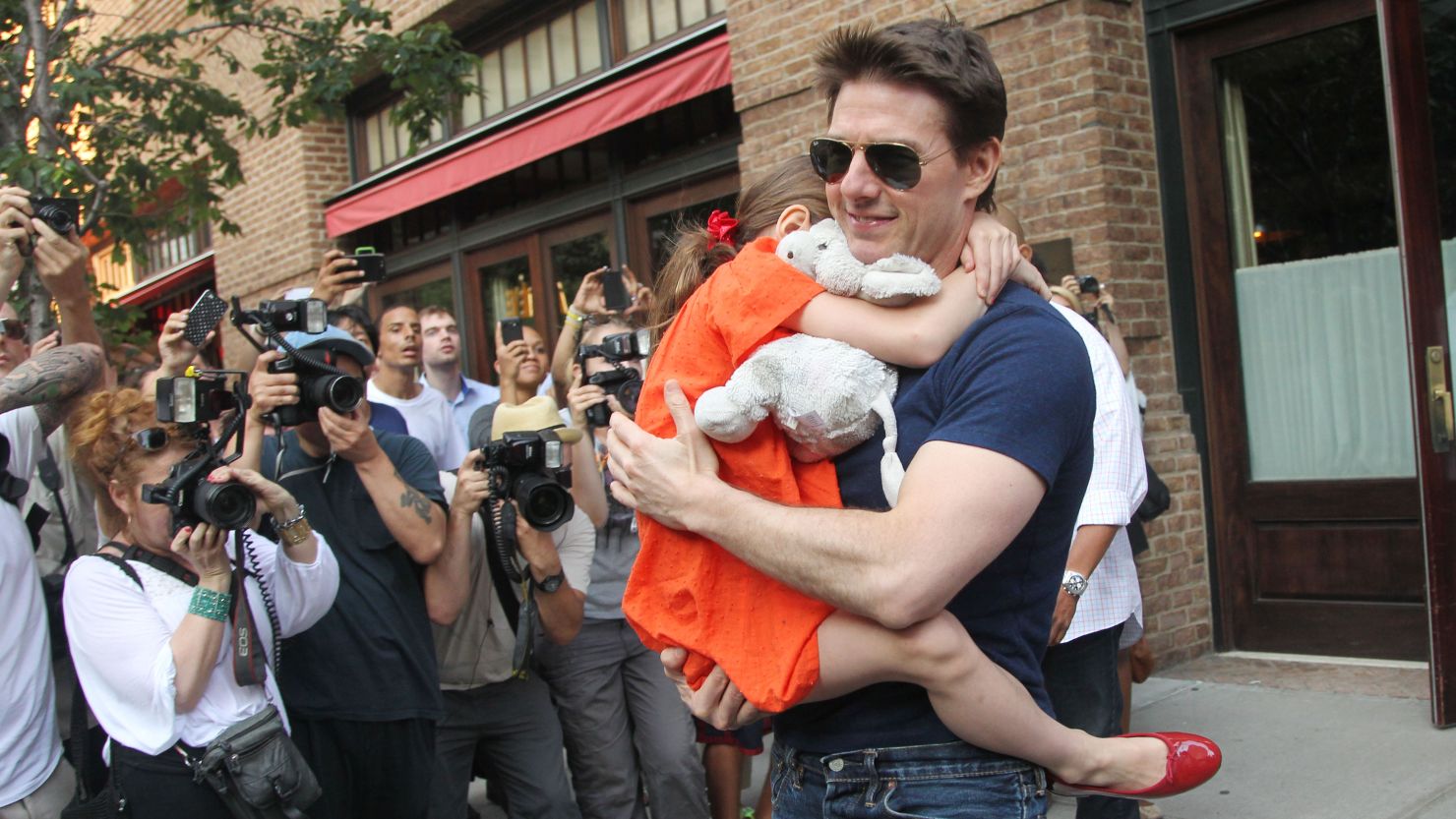 "I have in no way cut Suri out of my life," Tom Cruise says of his young daughter.