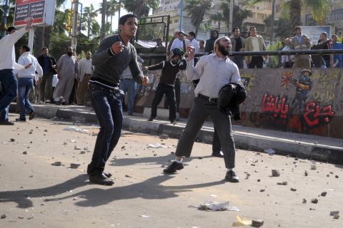Egyptian supporters and opponents of Morsy clash in the coastal city of Alexandria on Friday.
