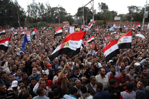 Morsy supporters gather outside the presidential palace in Cairo on Friday. Morsy insisted that Egypt was on the path to "freedom and democracy," as protesters held rival rallies over sweeping powers he assumed that further polarized the country's political forces.