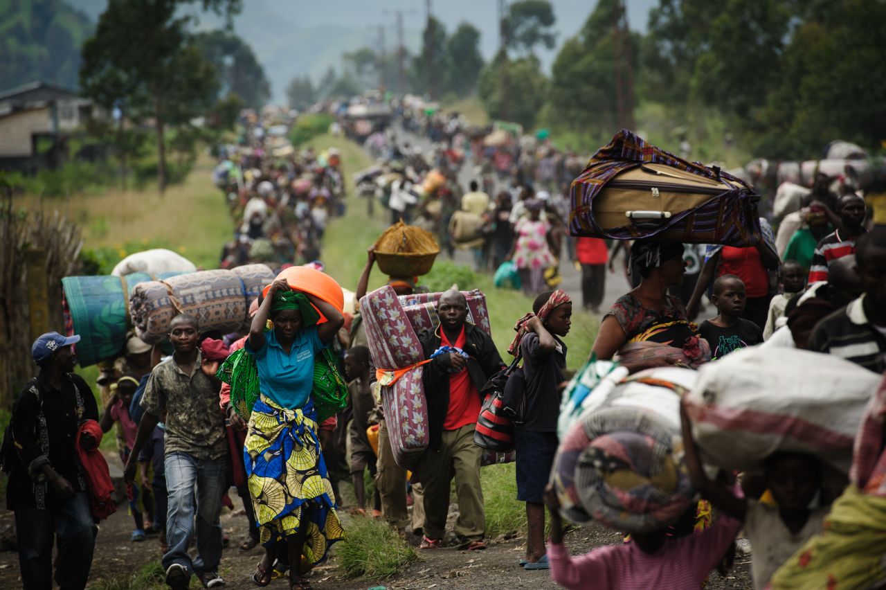 The M23 rebel group is fighting the Democratic Republic of Congo military for control of the country, and the violence is driving tens of thousands of Congolese out of their homes. Here on November 22, thousands fled the town of Sake and headed east to the camps for displaced in the village of Mugunga.