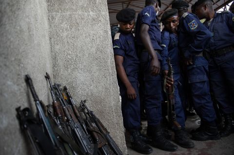 Surrendered police officers hand-in their weapons at the Volcanoes Stadium in Goma, in the east of the Democratic Republic of the Congo, on November 21, 2012.
