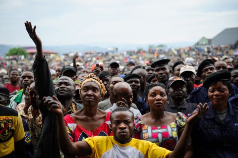Residents of Goma listen to M23 rebel group spokesman at the Volcanoes Stadium in Goma on November 21, 2012.