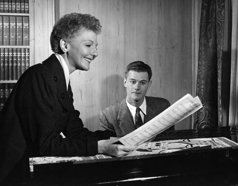 Hagman was the son of actress and singer Mary Martin. Here, they rehearse a song. 