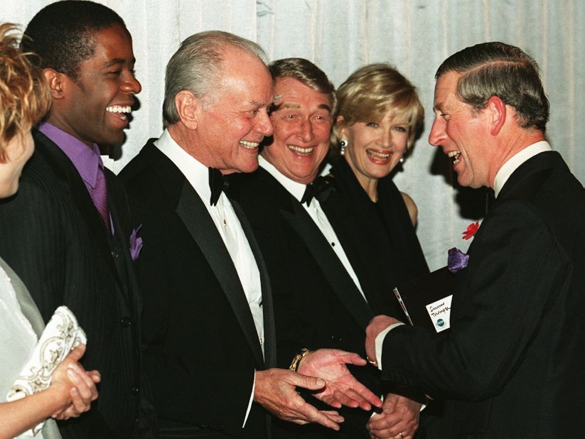 Britain's Prince Charles shares a light moment with actors Adrian Lester, left, Larry Hagman and Mike Nichols and journalist Diane Sawyer when the prince met the cast of the film "Primary Colors" on October 29, 1998.