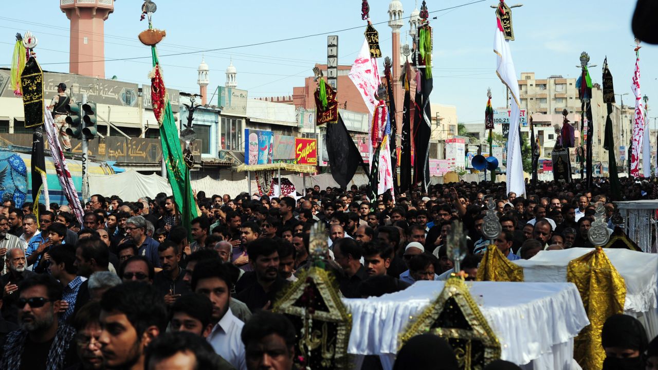 Pakistani Shiite Muslims march during a religious procession on the ninth day of holy month of Moharram in Karachi.
