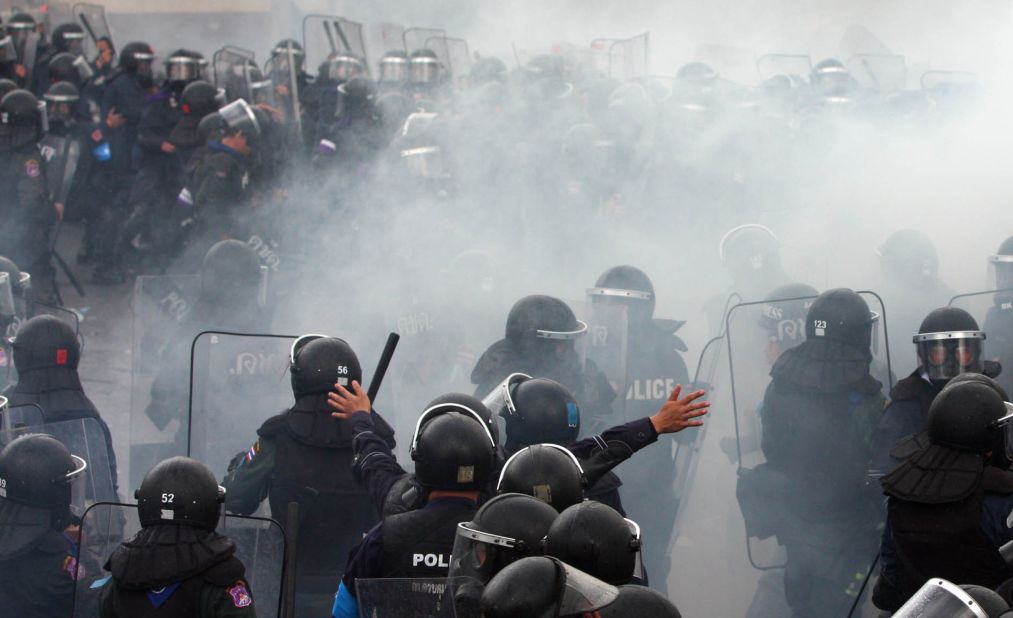 Thai riot police officers clash with demonstrators on Saturday.