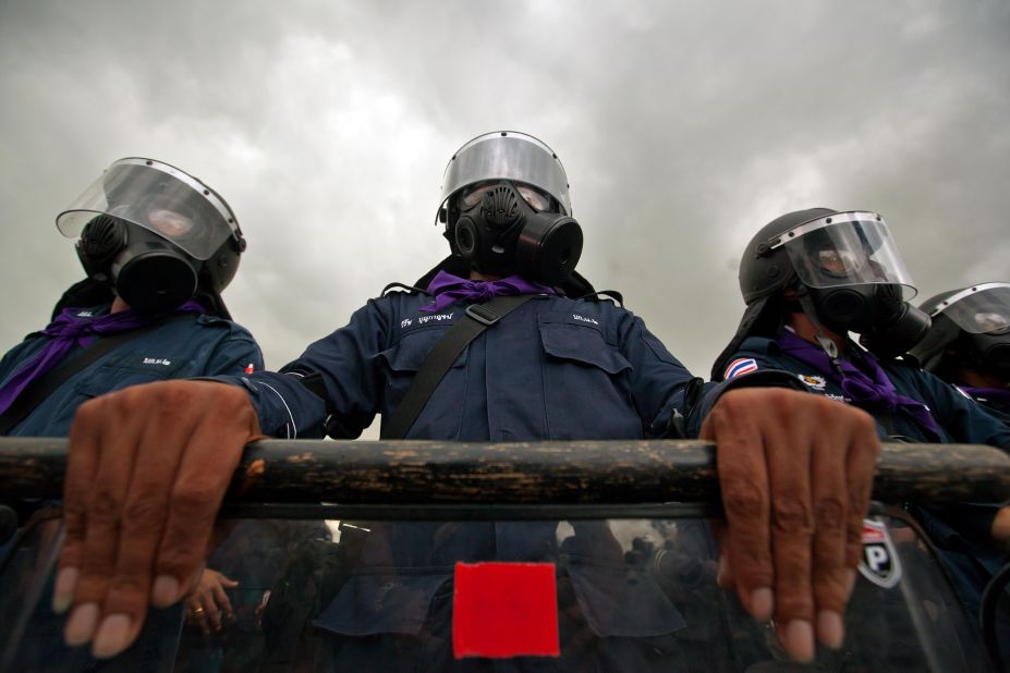 Thai riot police officers stand guard on Saturday.
