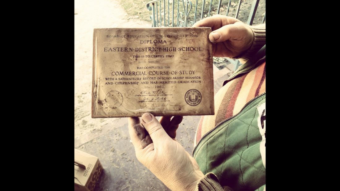 Residents and volunteers salvage what they can, including this high school diploma pulled from a flooded basement.