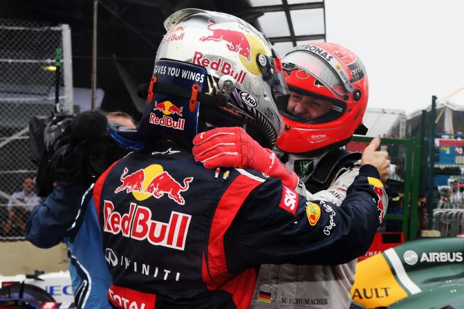 Michael Schumacher congratulates fellow German Vettel on his title triumph. Seven-time world champion Schumacher finished seventh in his final race before retirement. 