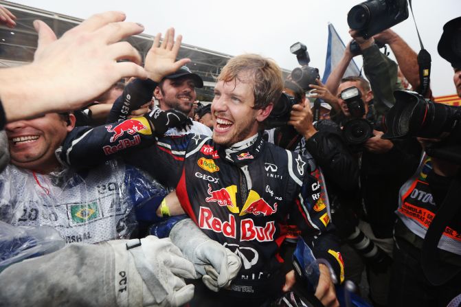 Vettel celebrates with his team and admirers after a pulsating race at Interlagos. There's sure to be a big party after another fantastic season for the German driver and the Red Bull team.