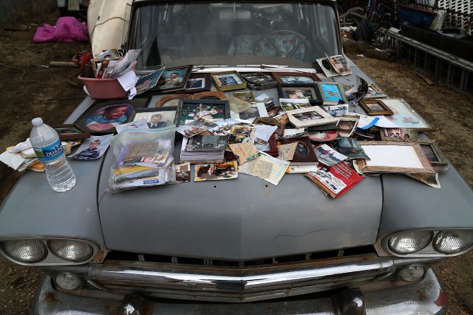 Old photographs are laid out to dry on a car hood on Sunday after being removed from a home in Seaside Heights.