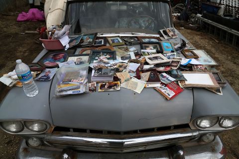 Old photographs are laid out to dry on a car hood on Sunday after being removed from a home in Seaside Heights.