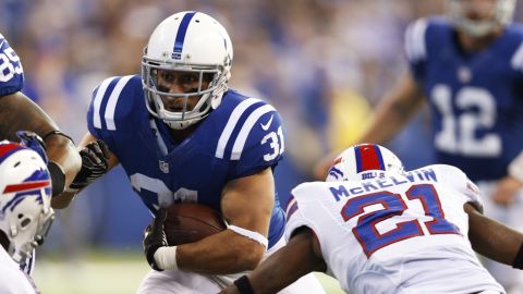 Donald Brown of the Colts runs with the ball against the Bills on Sunday.