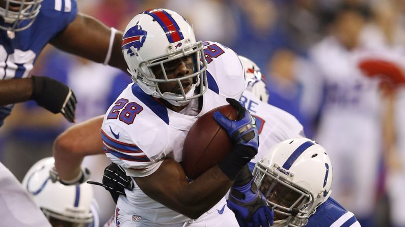 C.J. Spiller of the Bills gets tackled from behind by Kavell Conner of the Colts on Sunday.
