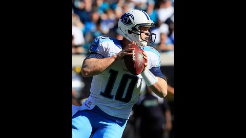Jake Locker of the Titans attempts a pass against the Jaguars on Sunday.