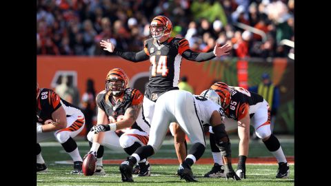 Andy Dalton of the Bengals gives instructions to his team during the game against the Raiders on Sunday.