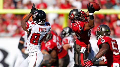 Safety Ronde Barber of the Tampa Bay Buccaneers intercepts a pass intended for receiver Roddy White of the Atlanta Falcons at Raymond James Stadium on Sunday in Tampa, Florida. 
