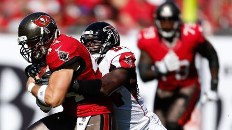 Tight end Dallas Clark of the Buccaneers is tackled by linebacker Stephen Nicholas of the Falcons on Sunday.