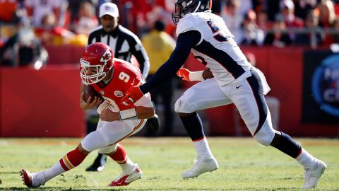Quarterback Brady Quinn of the Chiefs is sacked by outside linebacker Wesley Woodyard of the Broncos on Sunday.