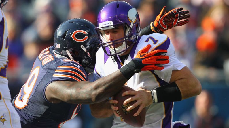 Christian Ponder of the Vikings is sacked by Henry Melton of the Bears on Sunday.