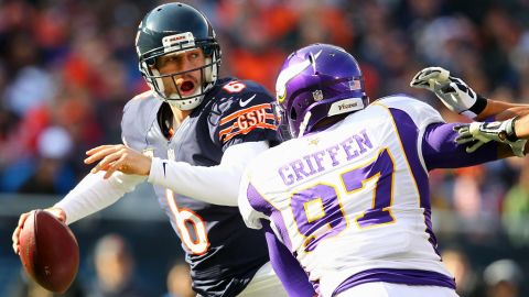 Jay Cutler of the Bears looks to avoid being sacked by Everson Griffen of the Vikings on Sunday.