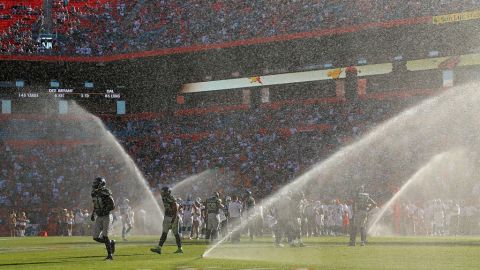 Sprinklers on the field go off during the game between the Dolphins and the Seahawks at Sun Life Stadium on Sunday in Miami Gardens, Florida. 
