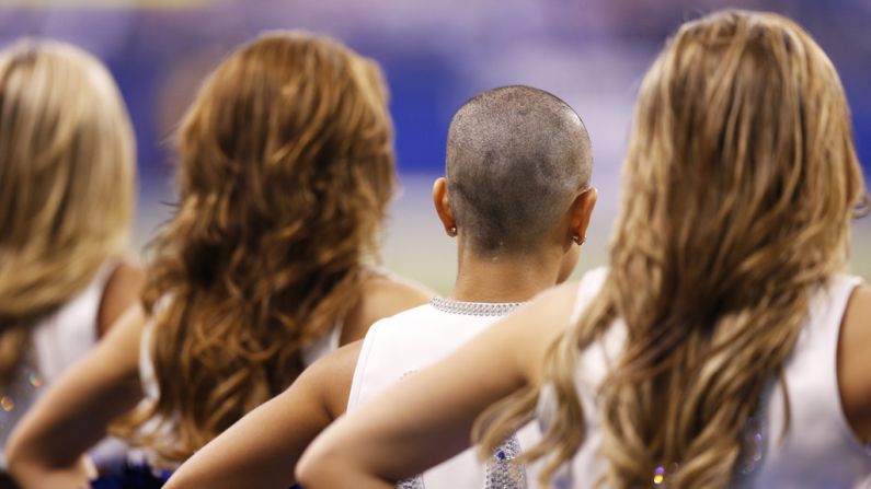 Indianapolis Colts cheerleader Crystal Ann stands with the rest of the squad after having her head shaved in support of head coach Chuck Pagano during the game against the Buffalo Bills at Lucas Oil Stadium on Sunday in Indianapolis, Indiana. The Colts won 20-13.